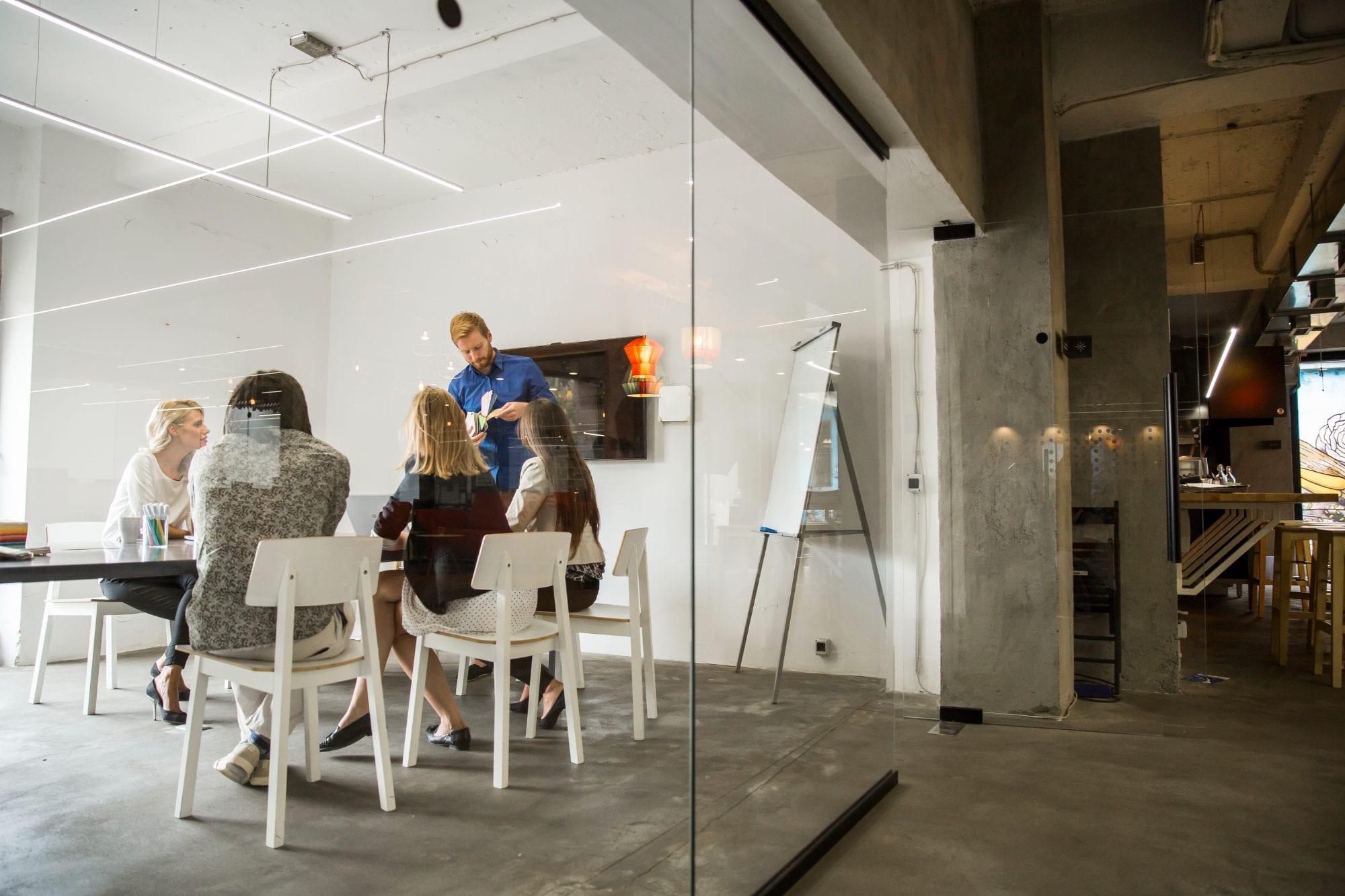Team in a meeting room around a conference table