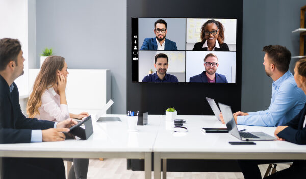 a conference room with a Microsoft Teams meeting