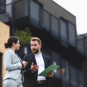 man and woman reviewing real estate contract