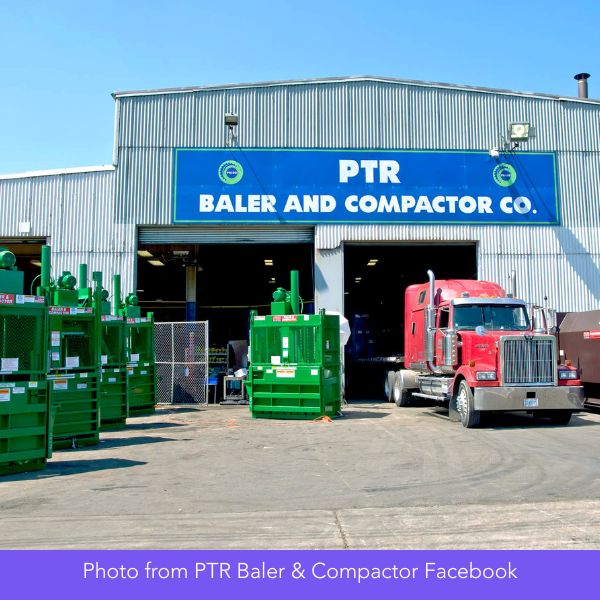 Exterior of PTR Baler and Compactor Co. shows a large industrial building, several green machines, and a red truck under a clear blue sky.