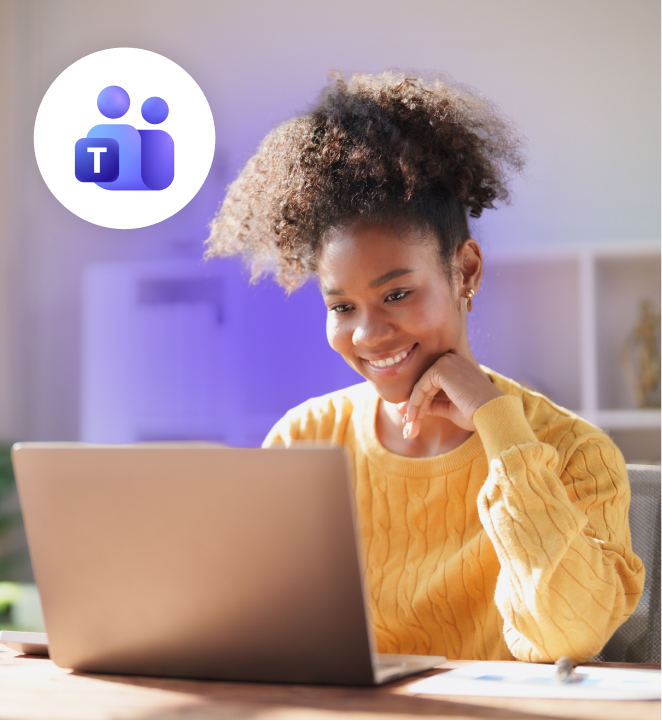 Smiling woman in a yellow sweater working on a laptop at home, with the Microsoft Teams icon displayed in a circular badge.