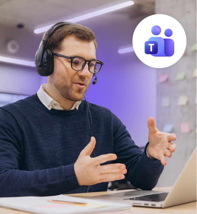 Man wearing a headset gesturing during a video call at his laptop, with the Microsoft Teams icon displayed in a circular badge.