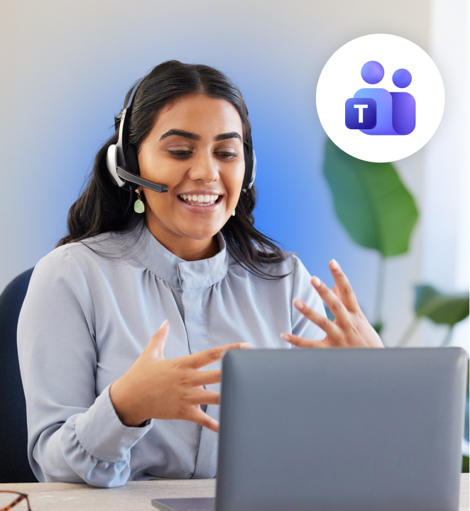 Smiling woman wearing a headset gesturing while on a video call at her laptop, with the Microsoft Teams icon displayed in a circular badge.